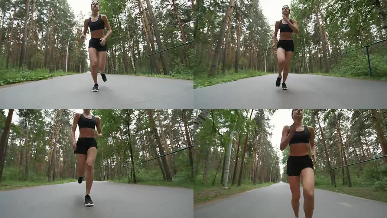 沿着森林路奔跑的健康女人