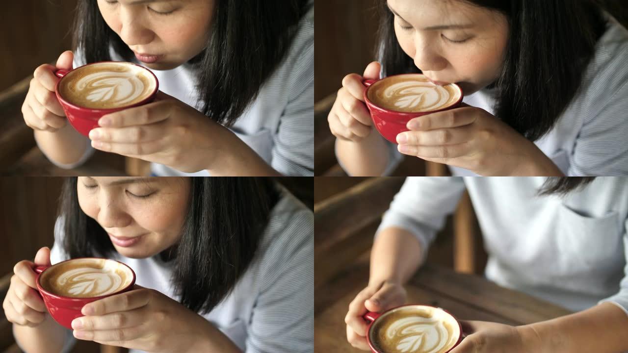 亚洲妇女喝咖啡咖啡享受咖啡的女人