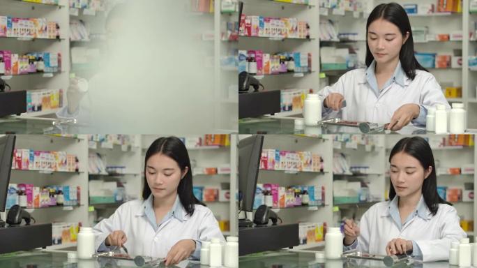 年轻的亚洲药剂师妇女数处方药。
