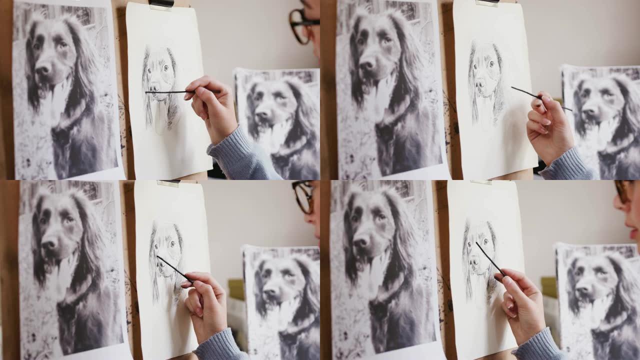 坐在画架上的艺术家的特写照片中的木炭狗的照片