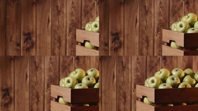 绿苹果放在乡村木桌上的板条箱里