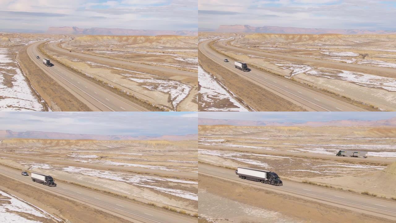 无人机: 在大型钻机上方飞行，在寒冷的沙漠中拖运货运集装箱
