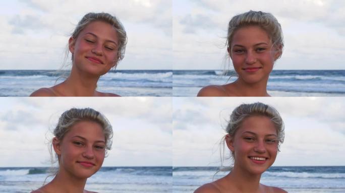 南非，美丽的年轻女子在海滩上害羞地看着相机的4k特写肖像