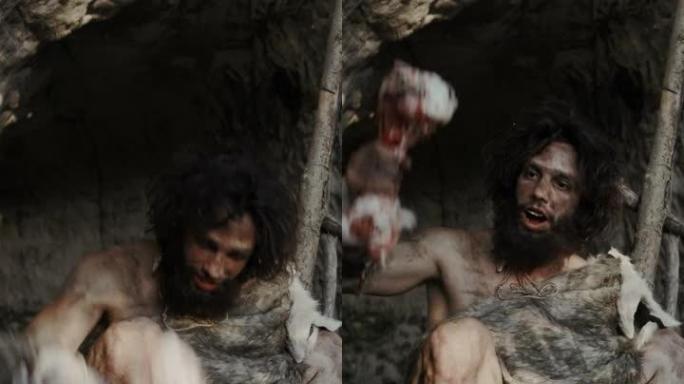穿着动物皮的原始穴居人拿着骨头，用它击中岩石。尼安德特人在洞穴入口附近鬼混，创造原始工具。垂直屏幕方