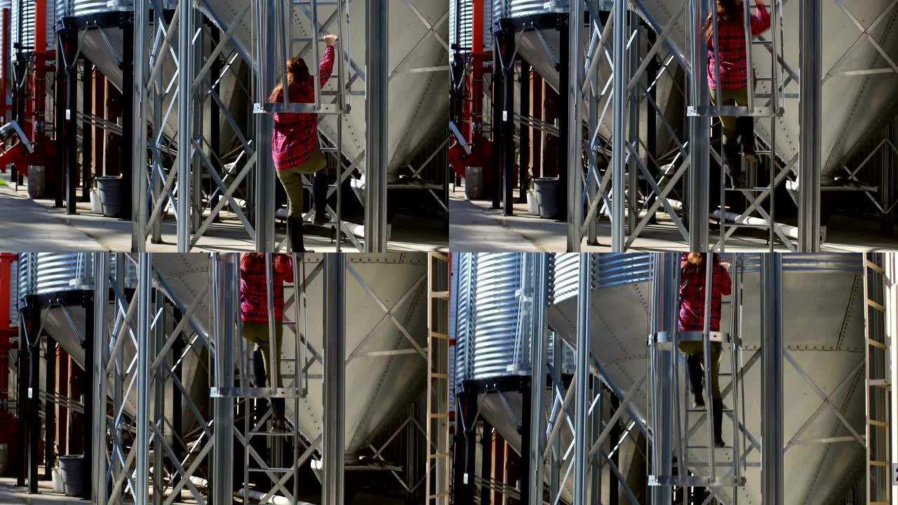 后视图白种女工爬梯子由储水箱4k