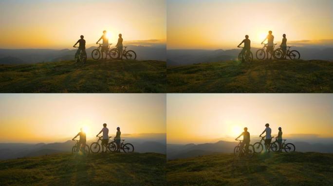 复制空间: 朋友们在越野自行车冒险后观察日落。