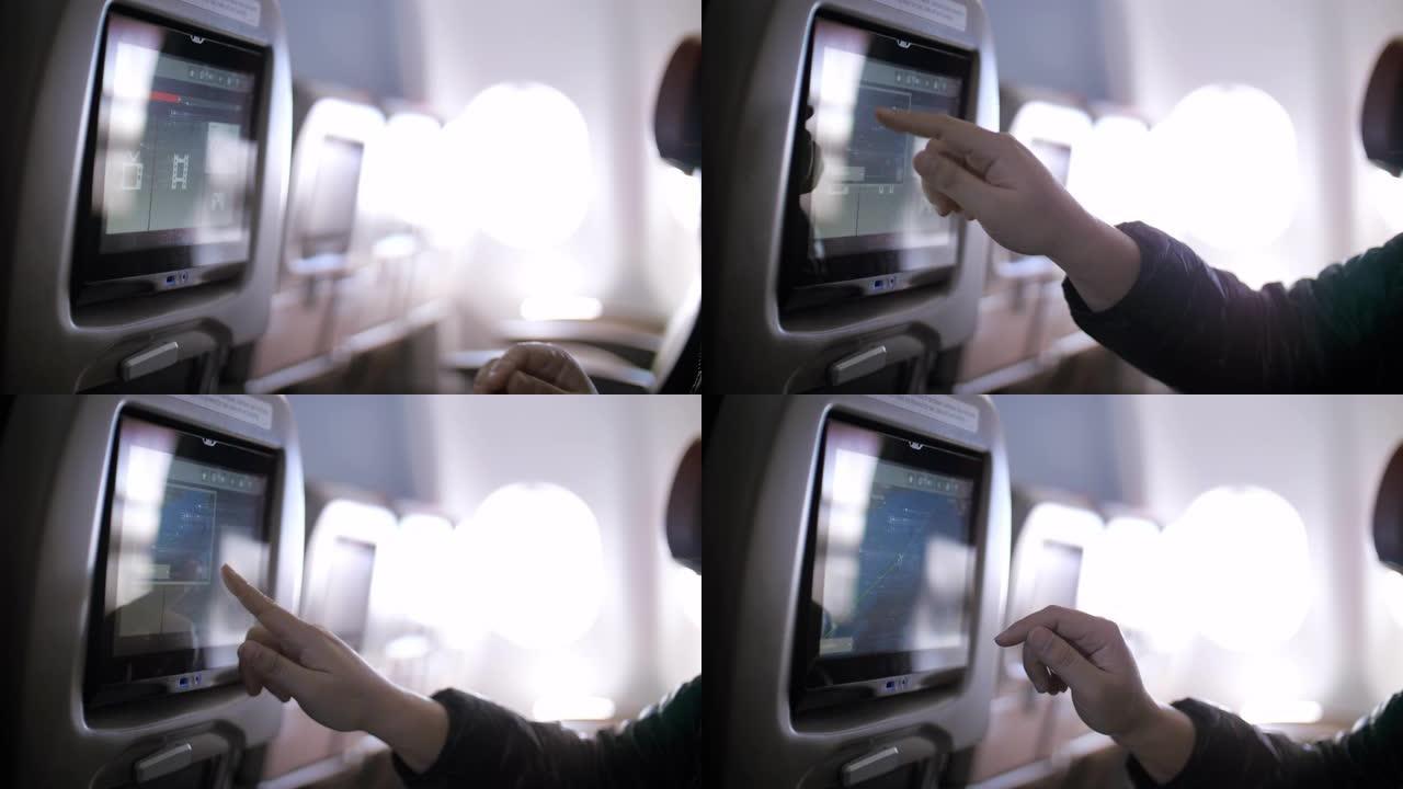飞机内部有女性乘客，在飞机机舱上使用多媒体触摸屏，慢动作