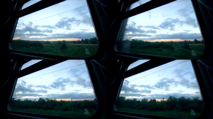 铁路旅行概念。火车的窗户上有透过它拍摄的暮光景观