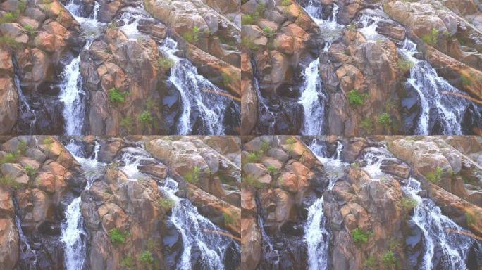 瀑布流入河流视频素材绿色植物湍流水花