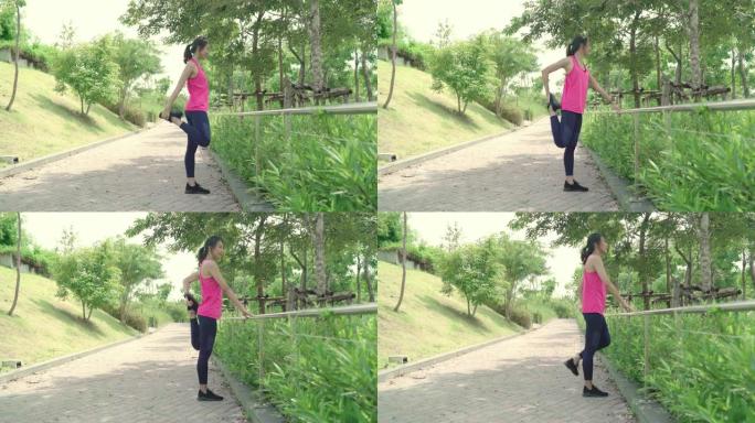 健康美丽的年轻亚洲运动员穿着运动服的女性腿部温暖和伸展手臂，准备在城市城市公园的街道上跑步。生活方式