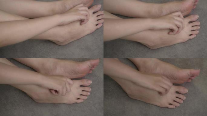 4k镜头特写镜头亚洲女子在家抓脚。医疗保健和医疗概念
