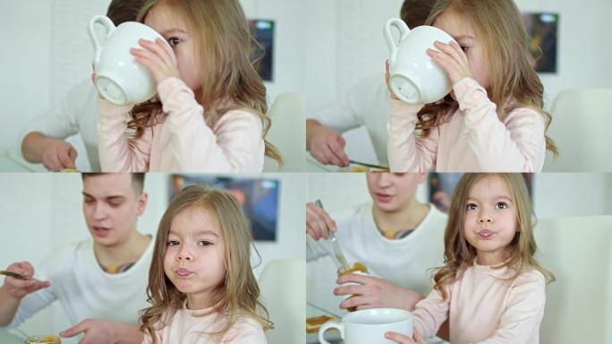 早上喝牛奶的可爱女孩