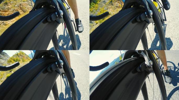 骑自行车上坡时旋转的公路自行车车轮的视图