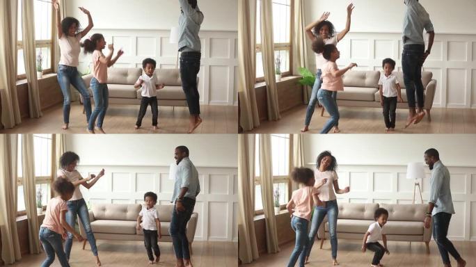 快乐的非洲裔美国父母和可爱的孩子在家里跳舞