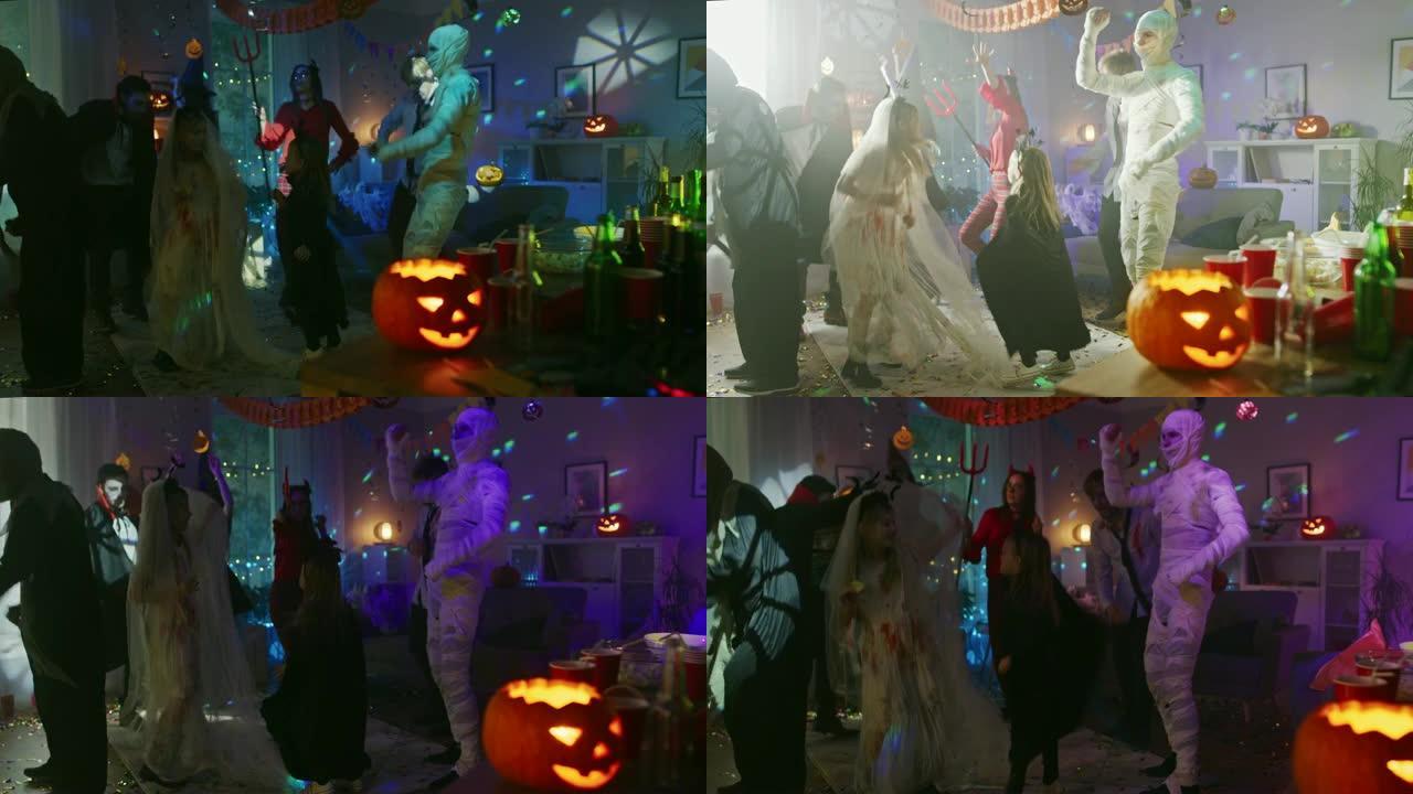万圣节服装派对: 一群年轻的怪物在装饰有迪斯科灯光的房间里跳舞和玩耍。僵尸、嗜血的德古拉、木乃伊、蛊