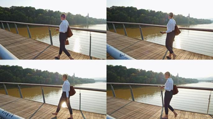 SLO MO现代女性赤脚走过一座桥
