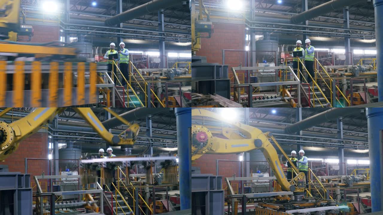 工厂同事检查一台用砖工作的机器。