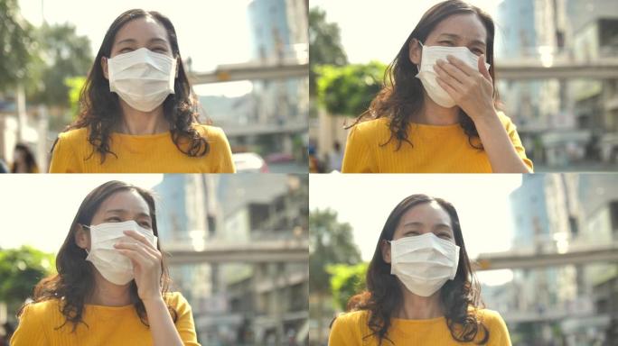 女商人戴着口罩保护污染的空气