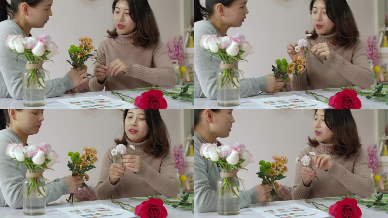 女孩花店正在训练她的朋友如何制作美丽的花束