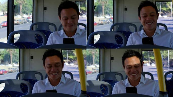 乘坐4k公交车时使用手机的男性通勤者