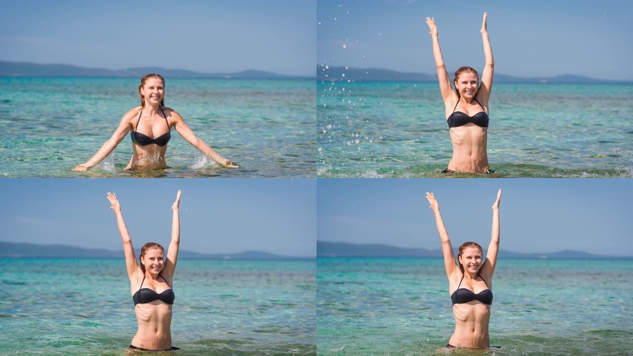 热带度假时穿着比基尼的快乐女人在炎热阳光明媚的夏日里溅海水