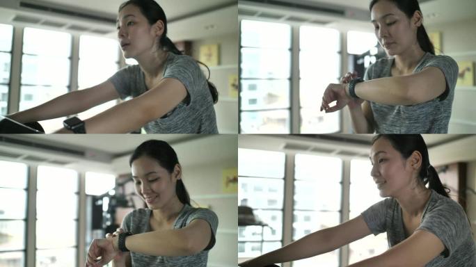 女人在锻炼时使用智能手表检查加号