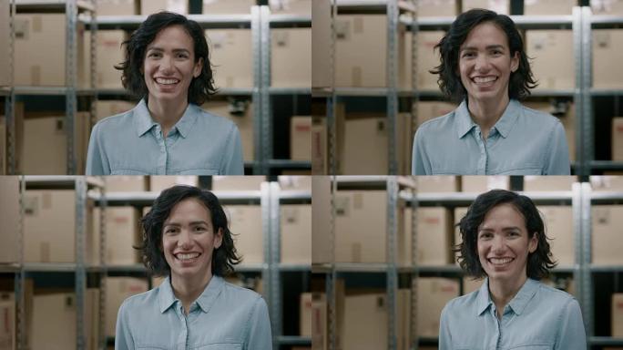 美丽的女性仓库库存经理的肖像站着，迷人地微笑着。才华横溢的职业女性与一排排装满纸箱和包裹的架子摆姿势
