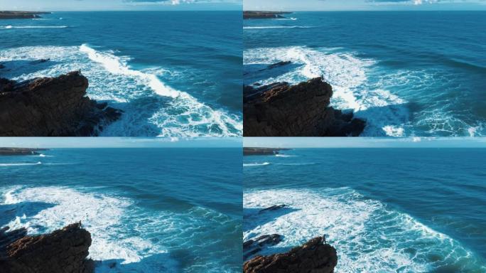 空中无人机镜头: 葡萄牙岩石海岸，海景优美。飞越葡萄牙，海岸线上海浪滚滚，坠入悬崖。孤独的渔夫正在钓