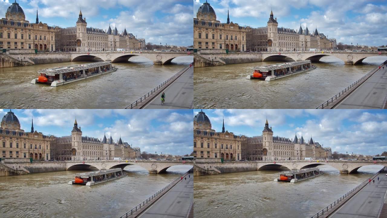 旅游渡轮穿过巴黎的河流在桥下。