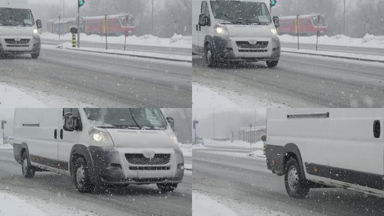 慢动作: 白色货车在强烈的暴风雪中沿着光滑的道路行驶。
