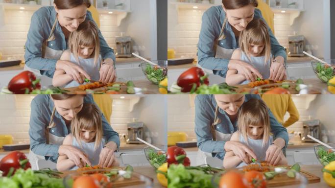 在厨房: 妈妈，可爱的小女儿一起烹饪健康的晚餐。母亲教小女孩健康的习惯，以及如何切蔬菜做沙拉。可爱的