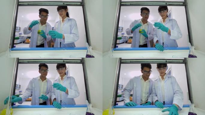 亚洲两位科学家致力于确定实验科学，如混合化学物质输入数据以开发科学药物。在生命科学实验室工作的卫生保