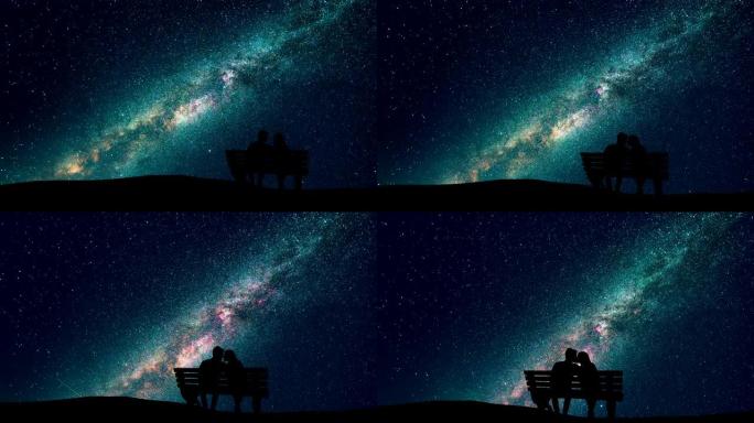 男人和女人坐在星空背景上的长凳上。时间流逝