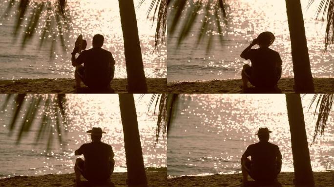剪影 -- 孤独的人在海滩上晒太阳