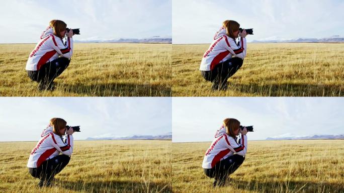 MS女摄影师用相机拍摄冰岛阳光明媚的偏远风景