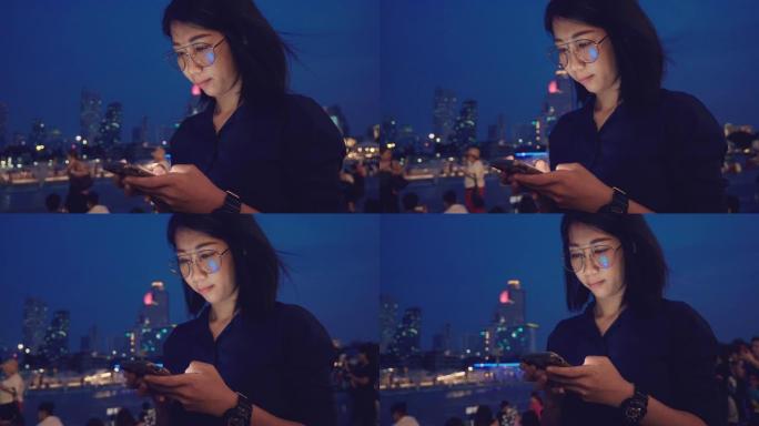 亚洲女性深夜使用智能手机。
