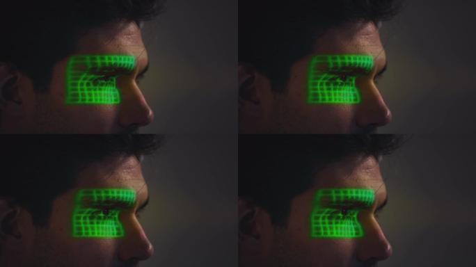 人脸识别技术的概念，作为人有绿色网格投影到眼睛在工作室