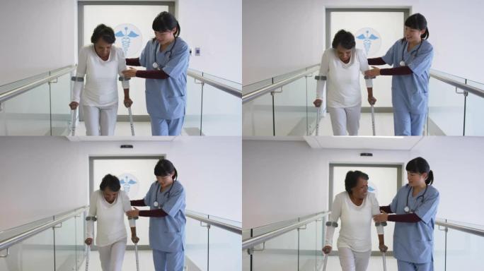 年轻医生在医院4k帮助患者使用拐杖