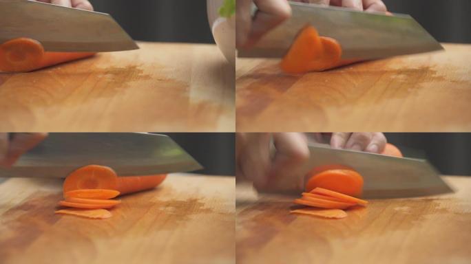 紧闭双手在厨房的木砧板上切碎胡萝卜