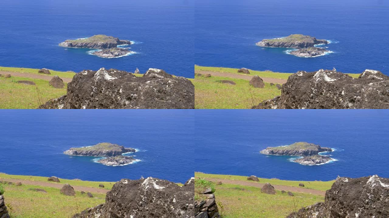 特写: 复活节岛附近的小岩石岛屿上方的风景。