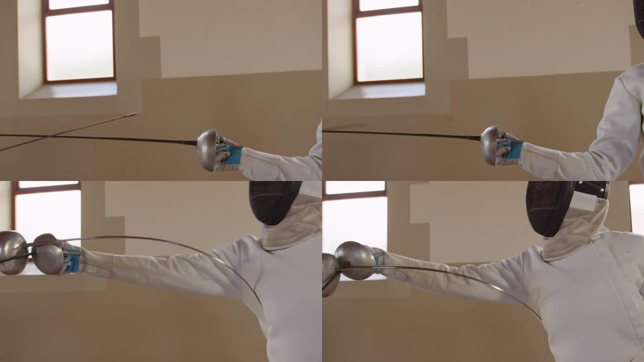 击剑运动员在健身房进行击剑训练