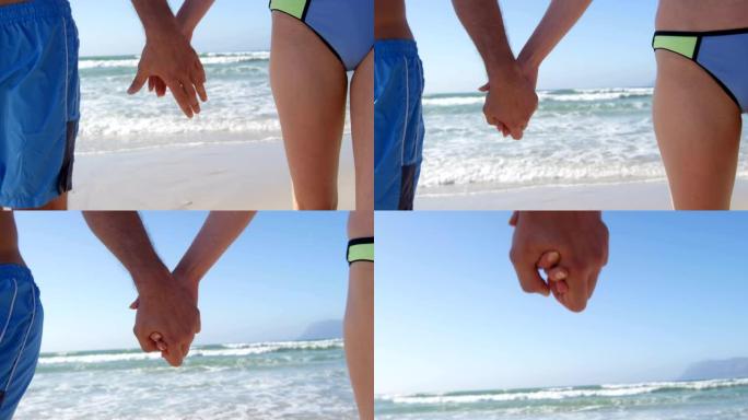浪漫情侣手拉手在4k海滩散步