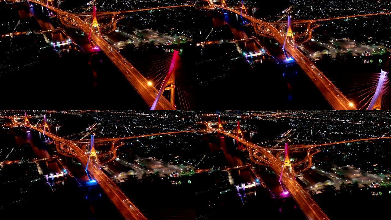 夜间两次穿越湄南河的普密蓬大桥工业环桥鸟瞰图