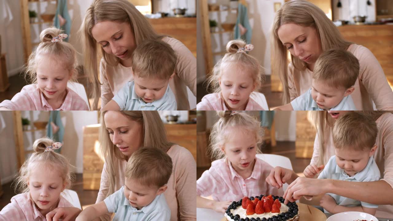 金发妈妈和孩子们用花园浆果做分层蛋糕