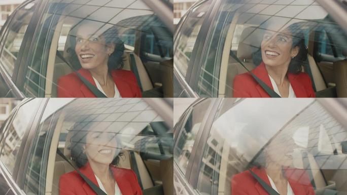 美丽的年轻女子坐在汽车的乘客座位上，惊奇地看着窗外。摄像机安装在移动汽车外部。