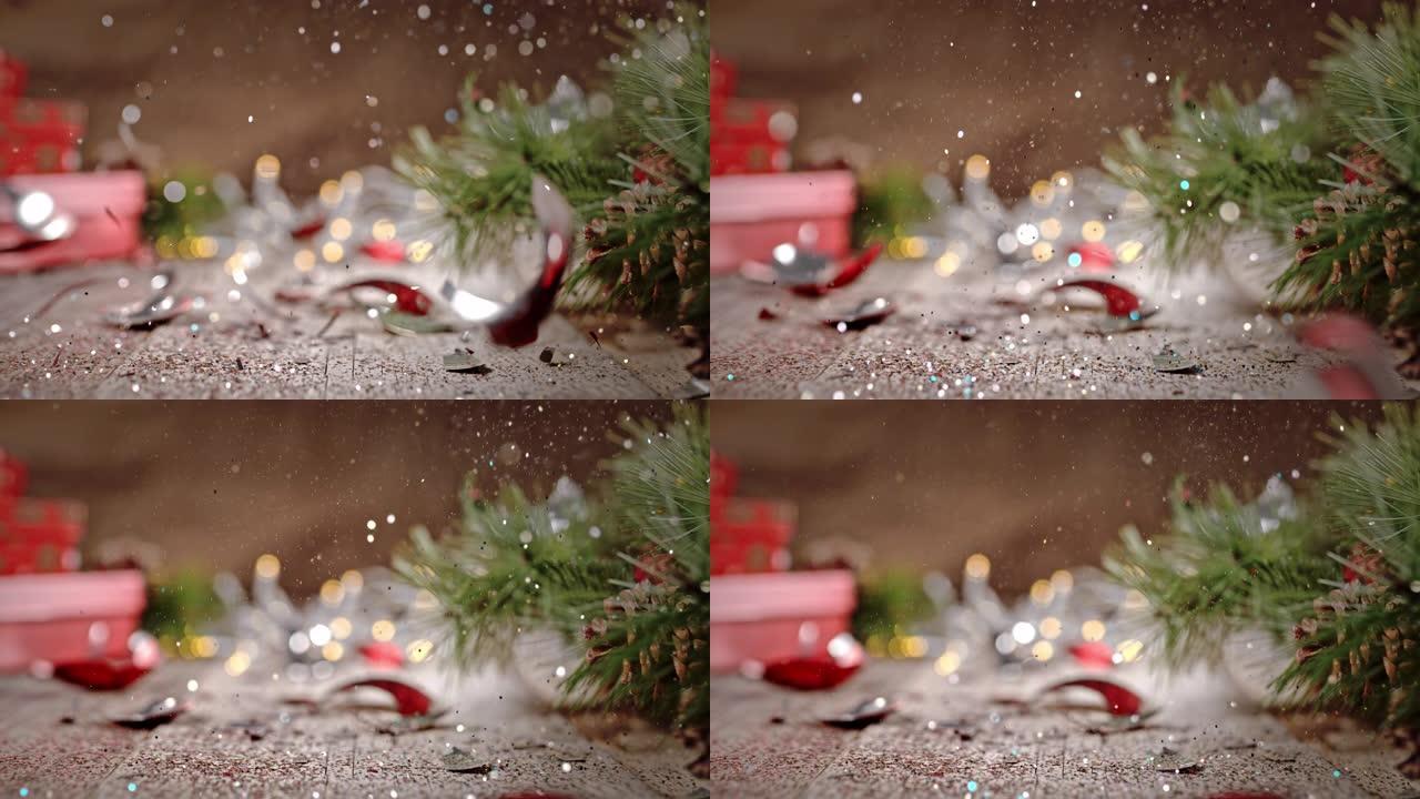 SLO MO圣诞球落在散落着闪光的地板上