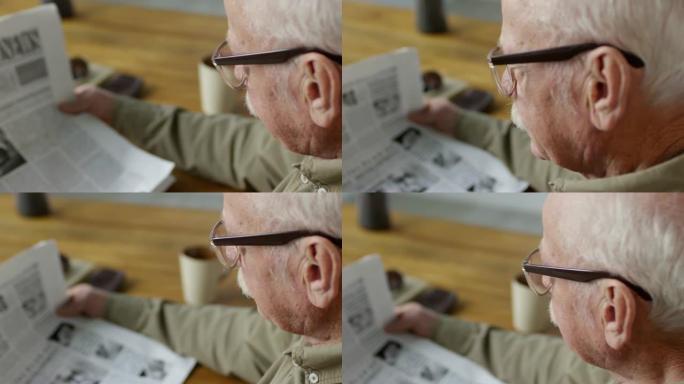 早上看报纸的老人老人看报纸老年人的退休生