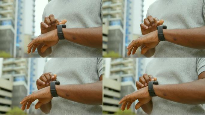 男子在4k城市使用智能手表