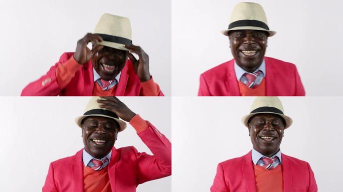 欢乐的非洲男人笑着戴上帽子