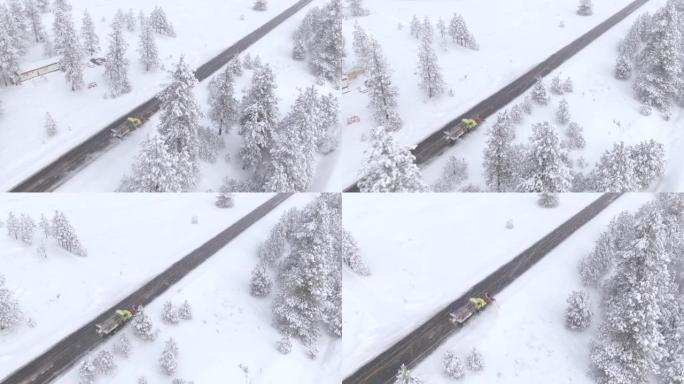 空中: 扫雪车清洁穿过森林的乡间小路。